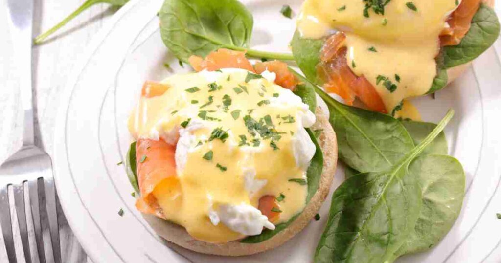 Golden-baked Salmon topped with a luscious egg, garnished with fresh herbs on a white plate. baked salmon &amp; eggs Baked Salmon &#038; Eggs: A Nutritious and Elegant Brunch Delight Baked Salmon Eggs 1024x538
