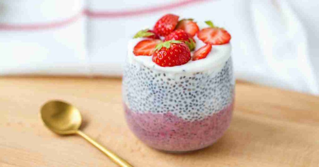 This is a bowl of creamy Classic Chia Breakfast Pudding topped with fresh berries and a drizzle of honey. classic chia breakfast pudding Classic Chia Breakfast Pudding Chia Breakfast Pudding2 1024x538