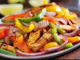 Colorful and appetizing Sheet-Pan Chicken Fajita Bowls with various fresh toppings.