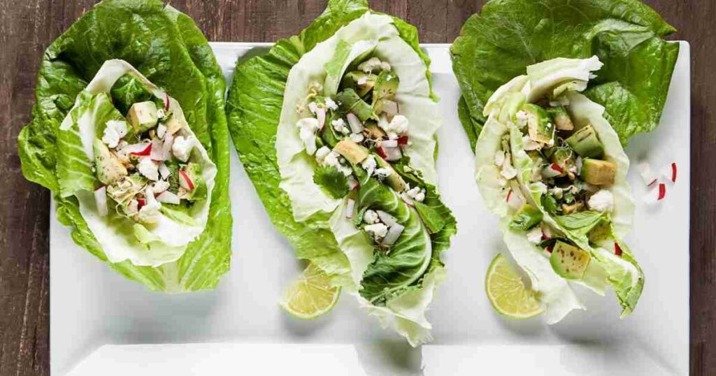 Fresh and vibrant taco lettuce wraps filled with seasoned meat, diced tomatoes, shredded cheese, and a dollop of sour cream, garnished with fresh cilantro. taco lettuce wraps: a fresh and healthy twist on a mexican classic Taco Lettuce Wraps: A Fresh and Healthy Twist on a Mexican Classic Taco Lettuce Wraps 1024x538